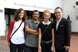 From left: Izabela Wilga, Faisal Al-Bahairi, Alicja Gutowska and Lin Xiumin at the entrance to the W. Lutoslawski Philharmonic Concert Hall in Wroclaw, 26th August 2012.